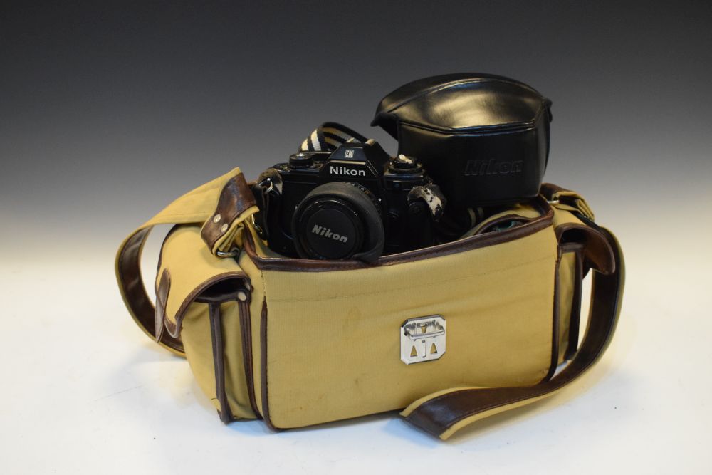 Nikon EM camera with accessories and carry bag