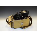 Nikon EM camera with accessories and carry bag