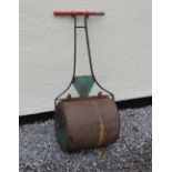 Vintage green-painted iron garden lawn roller