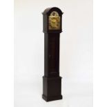 Reproduction mahogany finish Grandmother clock, the arched brass dial inscribed Metamec with chiming