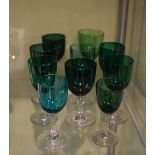 Eleven assorted 19th Century emerald green wine glasses with clear stems