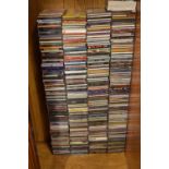 Large quantity of music CD's, pop, easy listening etc, together with a beech finish CD rack