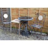 Pair of metal folding garden chairs, each with mosaic back, occasional table and painted wrought