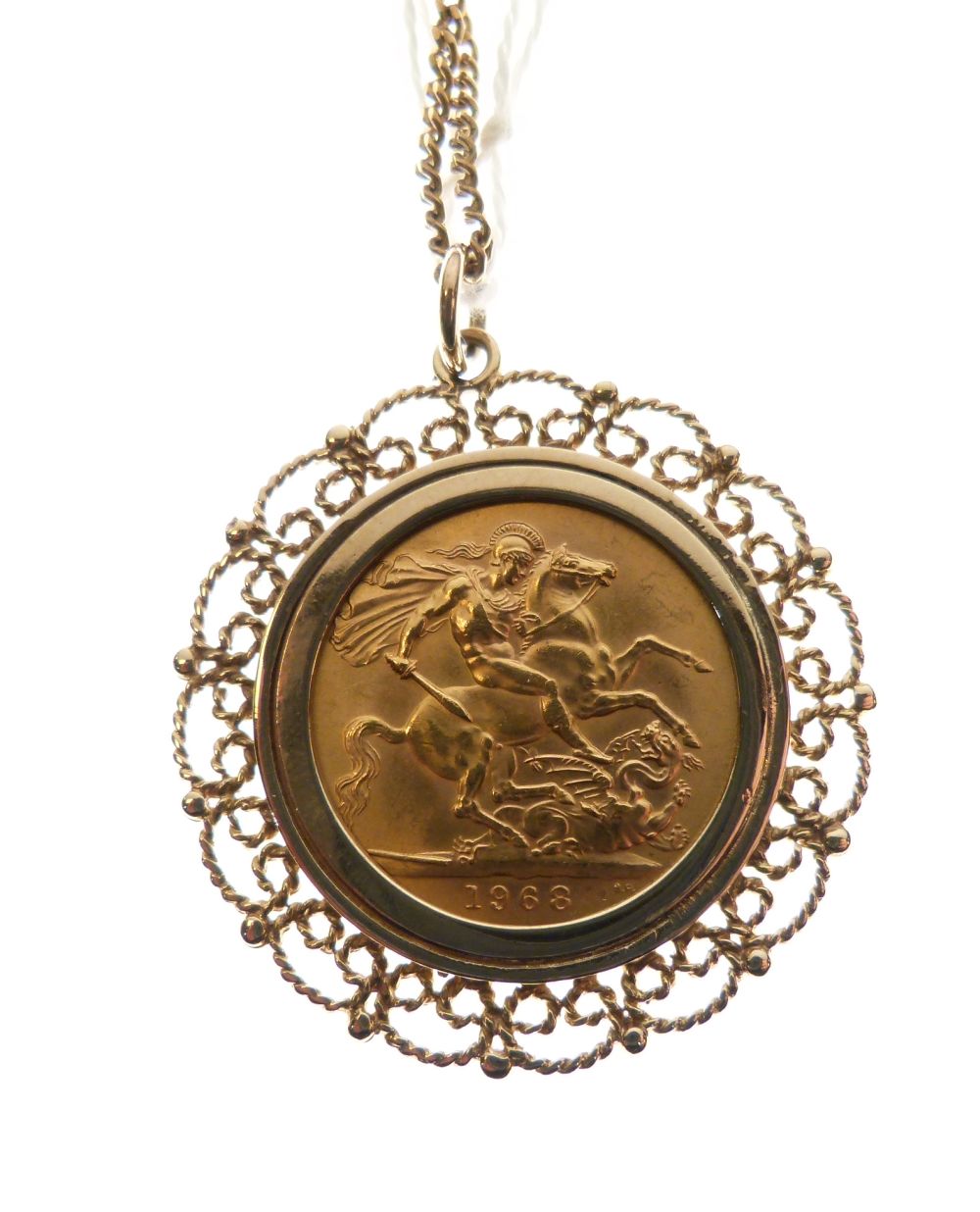 Gold Coin - Elizabeth II sovereign 1968, within yellow metal filigree mount with fine chain, 16.3g