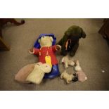 Small group of soft toys to include Paddington Bear, vintage Pug dog, cat etc