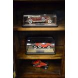 Three Franklin Mint Precision Model die-cast vehicles comprising 1930 Duesenberg J, 1928 Stutz Black