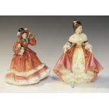 Two Royal Doulton figurines, 'Christmas Time' HN2110 and 'Southern Belle' HN2229 (2)