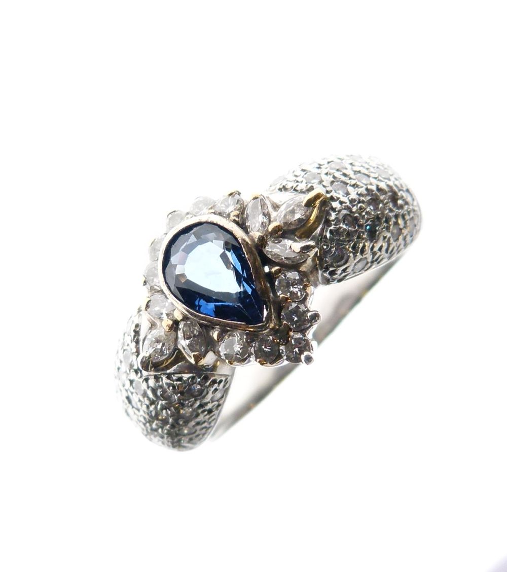 Yellow metal, sapphire and diamond dress ring, the pendeloque-cut sapphire enclosed by marquise