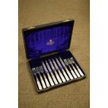 Early 20th Century cased half dozen mother-of-pearl handled fruit knives and forks, in fitted box of