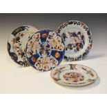 Four 19th Century Chinese export under glaze blue and iron red plates in the Imari taste, one