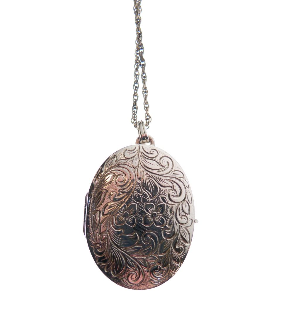 Sterling silver oval locket with engraved foliate scroll work to front, with fine chain