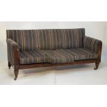 19th Century mahogany three seater settee with stuff-over back and arms, reeded front supports and