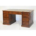 Late 19th/early 20th Century mahogany twin pedestal desk having green tooled leather inset, fitted