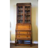 Early 20th Century oak bureau bookcase, the upper fitted pair of leaded glazed doors, 73cm wide