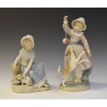 Two Lladro porcelain figurines, girl playing ball with dog, 27cm high and girl feeding cat, 19.5cm