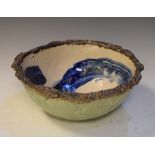 Oriental (Japanese or Korean) porcelain bowl with internal blue S scroll decoration and impressed