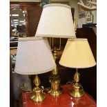Three assorted brass table lamps to include a pair (3)