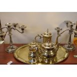 Assorted silver plated wares to include; pair of four-branch candelabra and four piece tea set