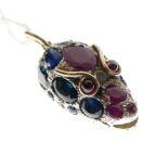 Unusual unmarked yellow metal pendant in the form of a snake or serpent head with ruby, sapphire and