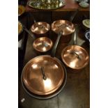Graduated set of five 20th Century French copper and steel cooking pans, stamped beneath Bourgeat,