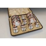 Cased set of six George V silver-mounted Copeland Spode coffee cans, decorated in the Imari palette,