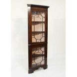 20th Century mahogany floor standing two section corner display cabinet, fitted two astragal
