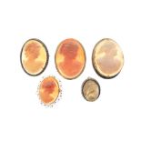 Five assorted shell cameo brooches to include; one 9ct gold, one yellow metal stamped 750, one