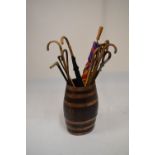 Copper-bound coopered barrel, 51cm high containing a selection of sticks, shooting stick, umbrellas,