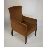 Early 20th Century easy chair with brown plush fabric on square tapered front supports with castors