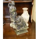 Two Oriental carved soapstone figures, together with a similar vase, the tallest 30cm high