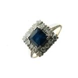 Yellow metal, platinum, diamond and sapphire dress ring, with central square sapphire within sixteen