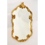 Reproduction rococo style gilt framed mirror, 75cm high