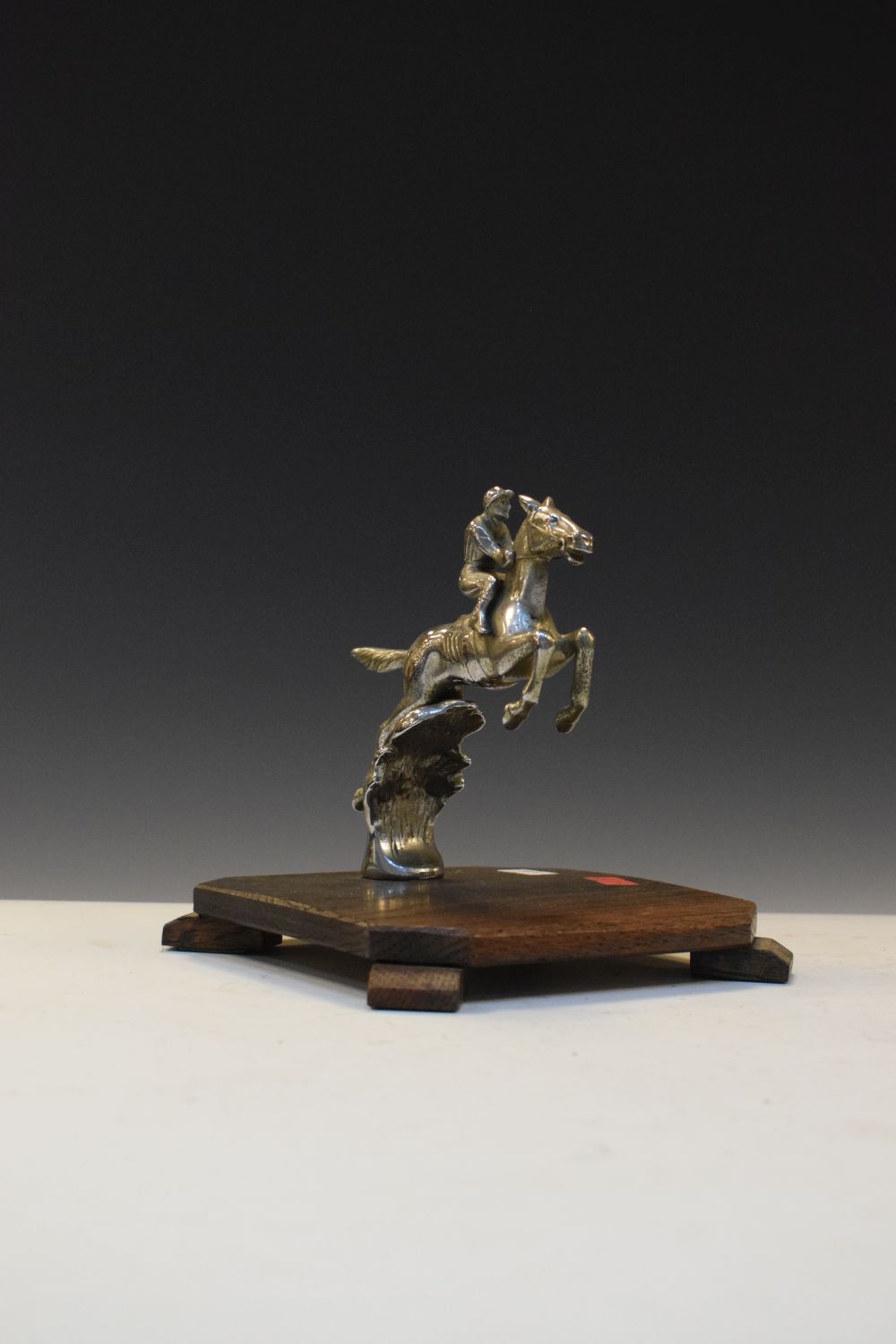1930's chrome horse and jockey car mascot, attributed to Desmo, on wooden mount