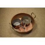 Copper two-handled cooking pan with rolled rim, 35.5cm diameter, together with two smaller cooking