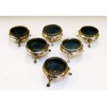 Six late Victorian silver salts, each of cauldron form with beaded rim on three hoof feet, four