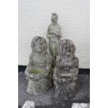 Three assorted garden ornaments to include; a pair of kneeling maidens holding shells, largest