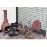Assorted metal work to include; cast iron fire back, cast iron plaque, fire front, iron cooking