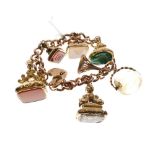 9ct gold curb link bracelet with heart shaped padlock, together with seven assorted fob seals,