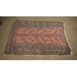 Early to mid 20th Century Middle Eastern hand-knotted wool rug, the brick-red field with floral