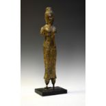 South East Asian cast metal figure of a Deity with truncated limbs, on rectangular plinth, 46cm high