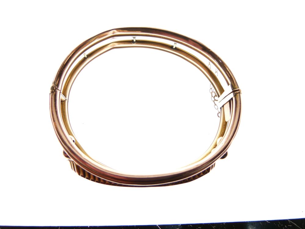 Edwardian 9ct rose gold snap bangle set a central band of red stones and diamond points, 12.5g - Image 2 of 4