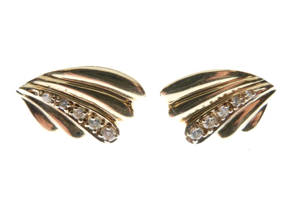 Pair of yellow metal ear studs, each of wing or fan design set with five graduated diamonds, stamped