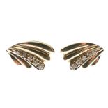 Pair of yellow metal ear studs, each of wing or fan design set with five graduated diamonds, stamped