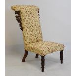 Victorian walnut prie dieu upholstered in foliate decorated cream ground fabric, raised on barley