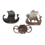 Viking longboat design brooch stamped Sterling Norway and two somewhat similar brooches, unmarked (