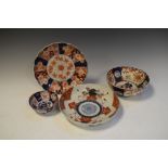 Three Japanese Imari lobed bowls and a similar plate, the largest bowl measuring 22.5cm diameter