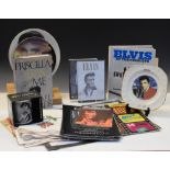 Elvis Presley - Assorted memorabilia to include; Blue Hawaii LP record, three singles, videos and