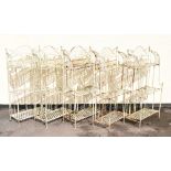 Five sets of cream-painted folding metal garden or display shelves, each approximately 115cm high