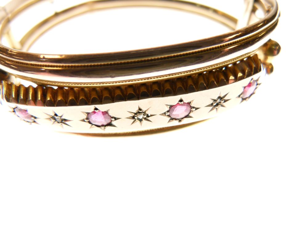 Edwardian 9ct rose gold snap bangle set a central band of red stones and diamond points, 12.5g - Image 4 of 4