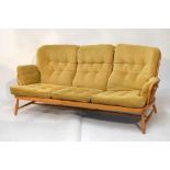 Ercol stick back three seater settee with deep button back, arms and seat, 195cm wide